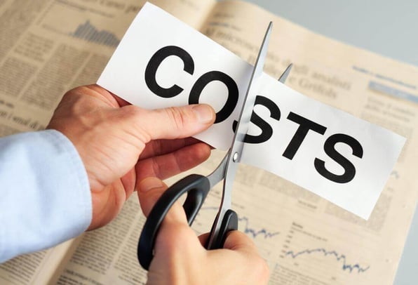 A man’s hands using scissors to cut a piece of paper with the word cost printed on it as he sees the low price of Pride Recovery’s legal debt administration costs.